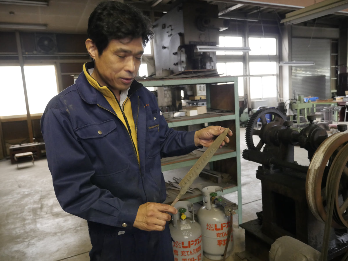 Nobuo Hanaki inspecting a forged blade at the Sukenari workshop, Toyama — April 2016.